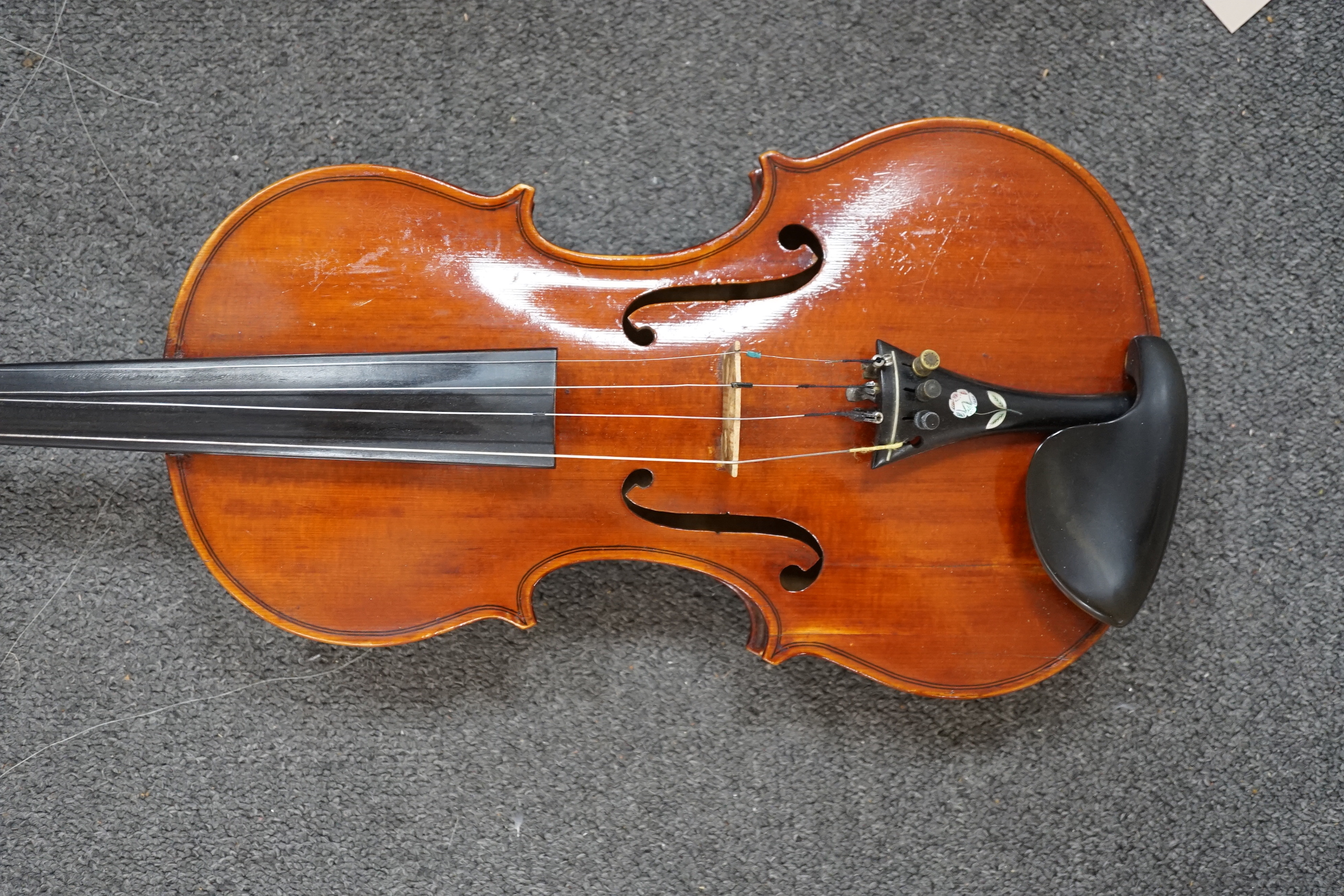 A 19th century violin with silver mounted bow and case, back measures 36cm CITES Submission reference JX7RJU7S